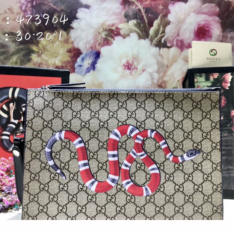 G*u*i clutch bags